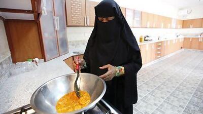 Souad Rabee Belal Al Budoor demonstrates how to make one of her spice mixes in her home in Umm Al Quwain. Sarah Dea / The National