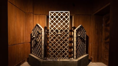 Bullet scarred mashrabiya screens from the grand mosque in Mecca, the result of an attack by insurgents in 1979 and now part of an art installation at Riyadh's Red Palace. Image courtesy of Athr and the artist