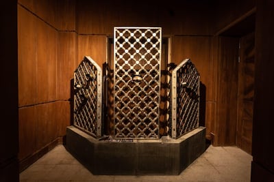 Bullet scarred mashrabiya screens from the grand mosque in Mecca, the result of an attack by insurgents in 1979 and now part of an art installation at Riyadh's Red Palace. Courtesy Sultan bin Fahd bin Nasser.