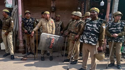 Riot police stand guard outside the Gyanvapi Mosque during Friday prayers in Varanasi. AFP