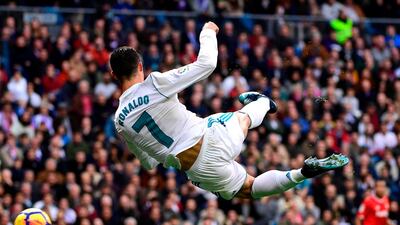 Real Madrid's Portuguese forward Cristiano Ronaldo controls the ball during the Spanish league football match between Real Madrid and Sevilla at the Santiago Bernabeu Stadium in Madrid. Pierre-Philippe Marcou / AFP Photo