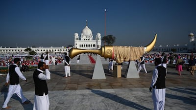 Pakistani plainclothes security officials stand guard near the inauguration site of the Shrine of Baba Guru Nanak Dev at Gurdwara Darbar Sahib in Kartarpur, near the Indian border. AFP