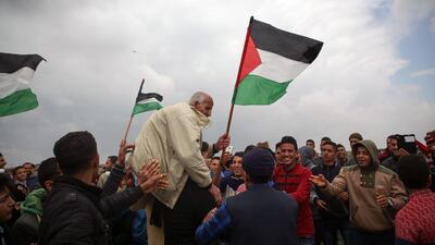 An elderly Palestinian man is carried by fellow protesters near the border with Israel east of Jabalia in the Gaza Strip. Mohammed Abed / AFP