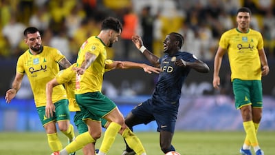 Sadio Mane of Al Nassr falls to the turf during the match against Al Khaleej. Getty Images