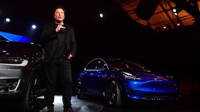 Mr. Musk speaks beside the just unveiled new Tesla Model Y. AFP