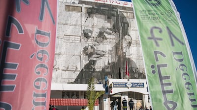 An image of street vendor Mohammed Bouazizi is depicted on the facade of the post office building in Sidi Bouzid. AP