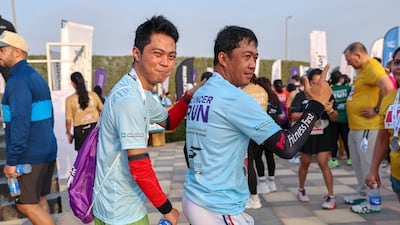 Participants celebrate after A Run for Hope Guinness World Records attempt on Saadiyat Island.