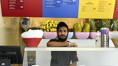 Manor Mohammed, 23, originally from India works at a milkshake cafe in Tourist Club Area for a year and a half. Khushnum Bhandari for The National