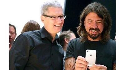 A reader praises the iPhone 5, launched by Apple CEO Tim Cook and musician Dave Grohl. Justin Sullivan / Getty Images