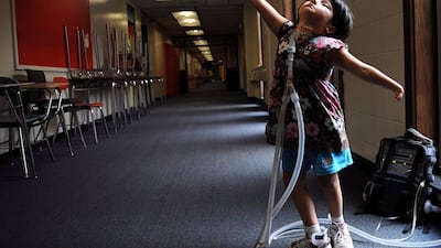 In an image by Essdras M Suarez, Jessica Leahey, 6, of Newton, Massachusetts, shows off a ballet move she’d just learnt at summer camp. Jessica has Mobius Syndrome, which is known as the mask disease, because those afflicted have no control over their facial muscles. Courtesy Xposure 2018
