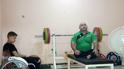 Iraqi paralympic weightlifter Thaer Al Ali rests between training sessions in tMosul on August 25, 2018. AFP