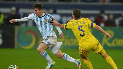 Lionel Messi and Argentina drew Romania 0-0. They'll play in Group F at the 2014 World Cup with Bosnia and Herzegovina, Iran and Nigeria. Daniel Mihailescu / AFP