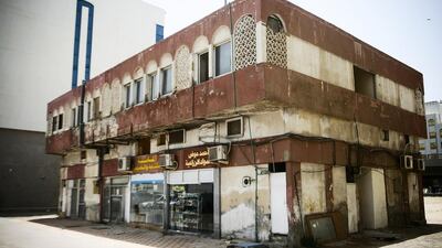 There were once more than a dozen of this type of mixed-use building in Abu Dhabi. This example, on Airport Road, now scheduled for demolition, is one of the last. Lee Hoagland / The National