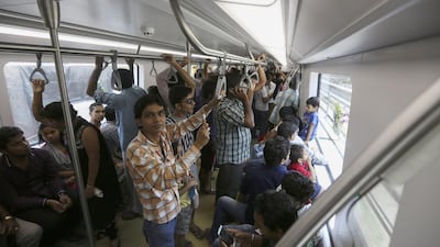 Commuters take the Mumbai metro on the first day of its opening. The metro line is expected to carry about 11,00,000 passengers every day, with at least 1,500 passengers per train. Divyakant Solanki / EPA