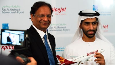 SpiceJet chairman and managing director Ajay Singh, left, and Sheikh Khalid Bin Saud Al Qasimi, vice chairman of RAK's Investment and Development Office. India's low-cost airline SpiceJet said it would use now-grounded 737 Max aircraft at its new hub in the UAE once regulators approve the planes for flight. AP
