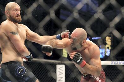A middleweight bout between Omari Akhmedov (red shorts) and Zak Cummings during the early matches of UFC 242. Chris Whiteoak / The National