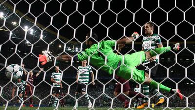 Sporting’s Sebastian Coates scores Barcelona's first with an own goal. Pedro Nunes / Reuters