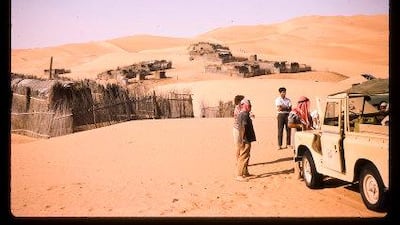 Palm frond huts in Liwa in 1967 with a Trucial Oman Scouts Landrover in the foreground