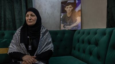 Abier Shole, 42, lost her son Mujahid, 16, in an Israeli strike in Nur Shams refugee camp. 'He was just a child,' she says. 'What happened to me is still easier to process compared to what is happening to people in Gaza.' She carries around her neck a copy of the poster of her son on the wall behind her