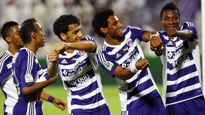 Asamoah Gyan, right, and his club Al Ain are both table-toppers in the Pro League this season. Satish Kumar / The National