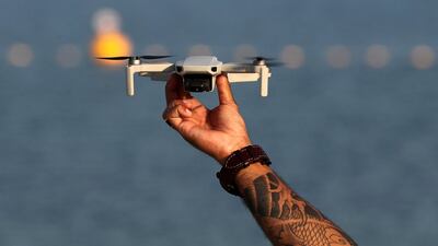 He uses a drone in order to see and take pictures of his work. Chris Whiteoak / The National