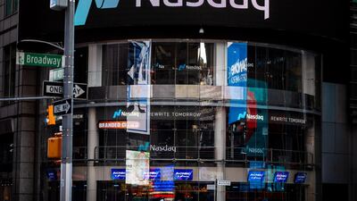 Signage is displayed outside the Nasdaq Market in the Times Square, New York. The bourse is set to tighten its listing rules. Bloomberg