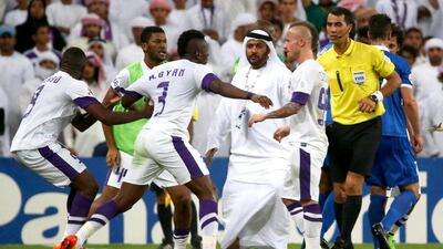 Al Ain’s Asamoah Gyan, centre, was sent off for an illegal tackle before this altercation. Marwan Naamani / AFP