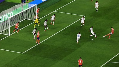 John McGinn of Scotland scores his team's first goal past Johny Placide of Haiti. The win was Scotland's first World Cup victory in 36 years. AFP
