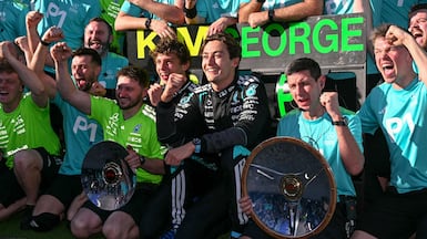 George Russell and Kimi Antonelli celebrate with the Mercedes team after the Australian Grand Prix. AFP
