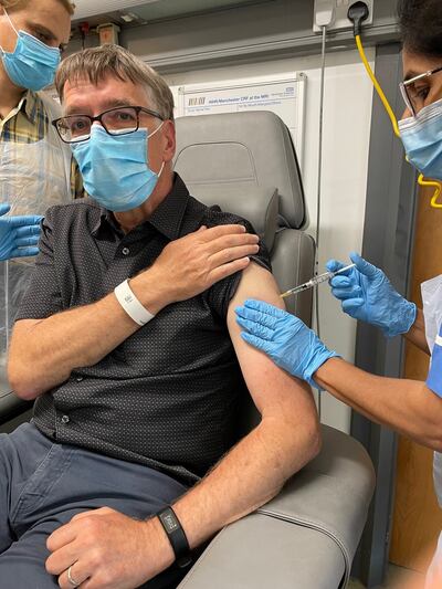 Participant Andrew Clarke with the clinical trials team in Manchester. PA