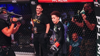 Saudi Arabia's Hattan Al Saif enters the cage.