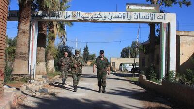 Syrian soldiers walk at the Kweyris military air base in the northern Syrian province of Aleppo. Syria's military broke a more than a year-long jihadist siege of the air base in the country's north, scoring its first major breakthrough since the Russian air campaign began. George Ourfalian / AFP