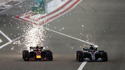 Max Verstappen, left, and Lewis Hamilton race against each other during the Bahrain Grand Prix. Lars Baron / Getty Images