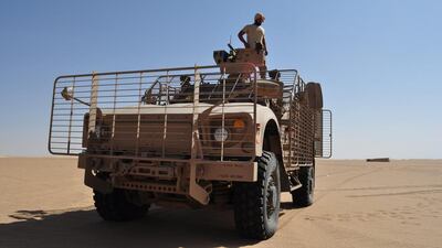 An Emirati soldier checks the gun atop an armoured vehicle at a military base near Saffer in Yemen’s Marib province. Adam Schreck / AP