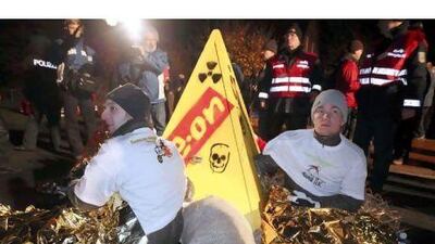 Nuclear protesters chain themselves to a concrete pyramid protest sign in Germany last week.