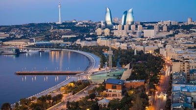 A view along Baku's waterfront, with the Flame Towers and TV tower in the distance. Getty Images