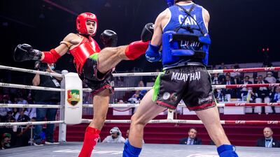 Bilal Ibrahim of UAE, red, takes on Riley Foden of Canada.