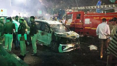 Indian police personnel inspect the scene of a blast near the red fort in New Delhi, India. EPA