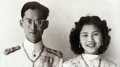 An undated handout photo made available by the Thai Royal Bureau shows portraits of Thai King Bhumibol Adulyadej and Queen Sirikit. Royal Bureau / AFP