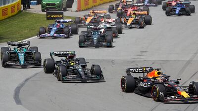 Max Verstappen leads at the start of the race. EPA
