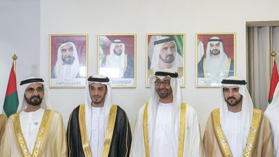 ABU DHABI, UNITED ARAB EMIRATES - November 27, 2018: HH Sheikh Mohamed bin Zayed Al Nahyan, Crown Prince of Abu Dhabi and Deputy Supreme Commander of the UAE Armed Forces (2nd R) and HH Sheikh Mohamed bin Rashid Al Maktoum, Vice-President, Prime Minister of the UAE, Ruler of Dubai and Minister of Defence (L), attend the wedding reception of HH Sheikh Mohamed bin Khalifa bin Khaled Al Nahyan (3rd L), at The St Regis Saadiyat Island Resort. Seen with HH Sheikh Hamdan bin Mohamed Al Maktoum, Crown Prince of Dubai (R). ( Mohamed Al Hammadi / Ministry of Presidential Affairs ) ---
