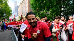 An Egypt supporter marching in a parade ahead of the Egypt game. Getty Images via AFP