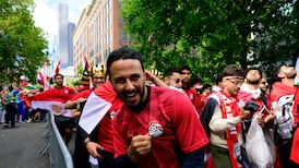 An Egypt supporter marching in a parade ahead of the Egypt game. Getty Images via AFP