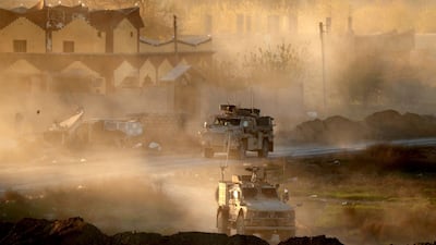 US army vehicles supporting the Syrian Democratic Forces (SDF) in Hajin. AFP