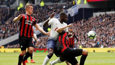 Tottenham's Moussa Sissoko in action with Huddersfield Town's Jon Gorenc Stankovic and Jonathan Hogg. Reuters