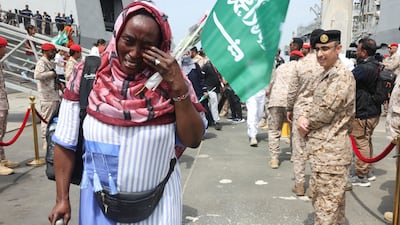 A Sudanese woman disembarking from a Saudi Navy Ship at the Jeddah Sea Port. May 8, 2023. REUTERS