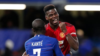 Paul Pogba, right, with World Cup-winning teammate N'Golo Kante after the FA Cup fifth round tie. AP Photo