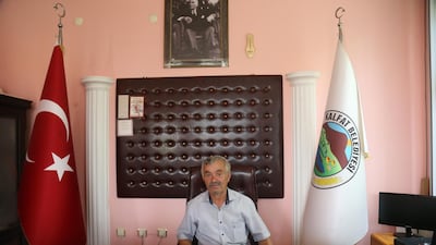 Bayram Tavukcu serves as the village leader in Kalfat. EPA Special Commission