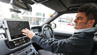 Safety driver Jim O'Donoghue. Autonomous vehicles still need human escorts but the job is said to be pretty boring. Frank Augstein/AP