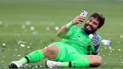 Alisson Becker takes a selfie at the final whistle. PA Photo
